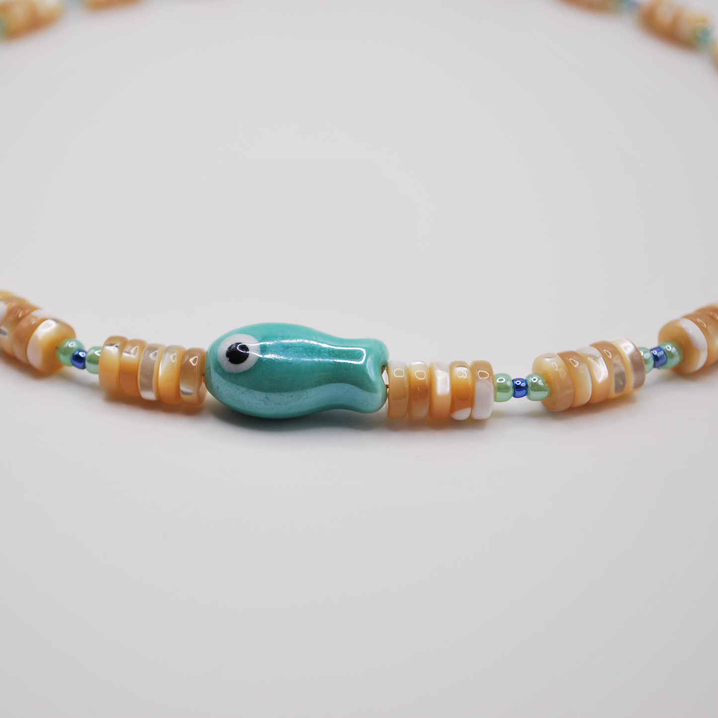 'lucky catch' beaded necklace with seafoam green fish charm