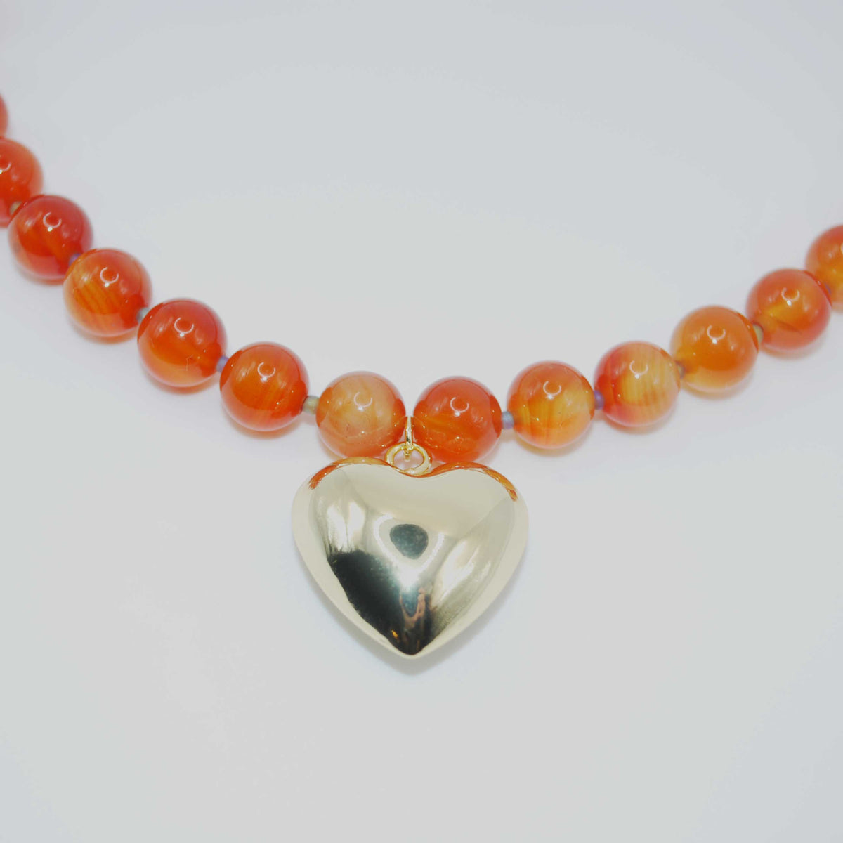 spiced coral’ carnelian beaded necklace with gold heart charm