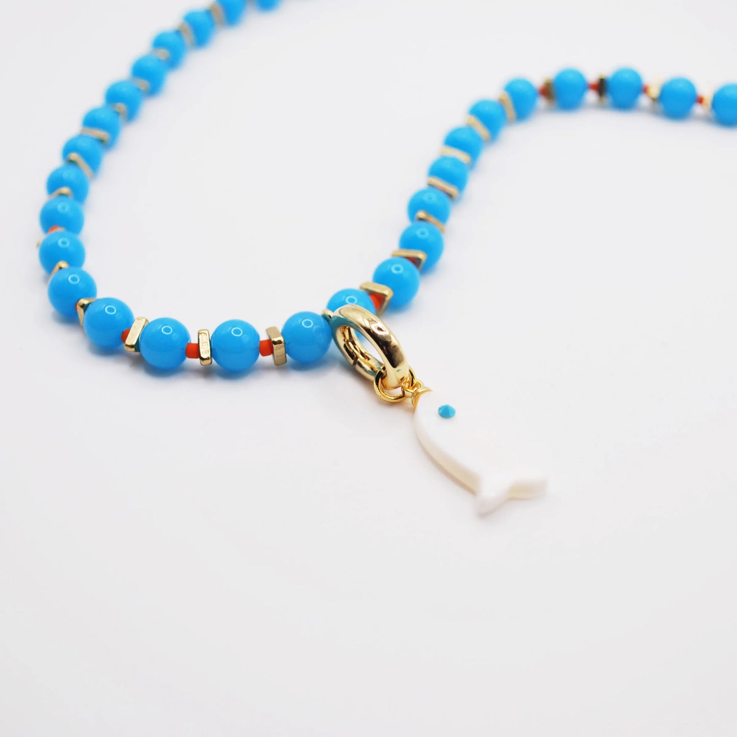 'tidepool' blue beaded necklace with white fish charm