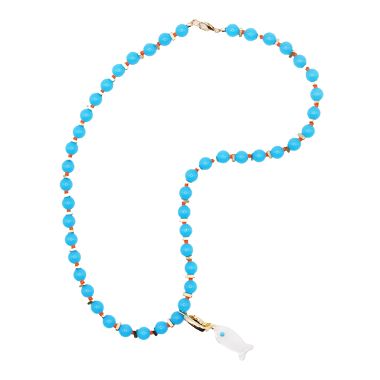 Inspired by shallow coastal pools and shifting light, the 'tidepool' necklace features handcrafted blue beads with a white fish charm.