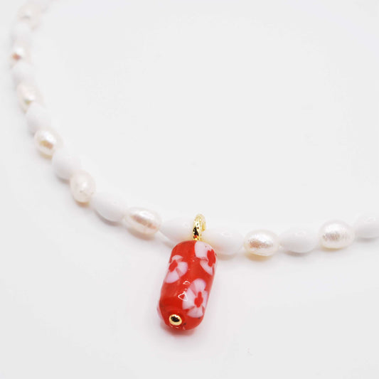 'cherry tide' white pearl beaded necklace with a bold pink & red bead charm