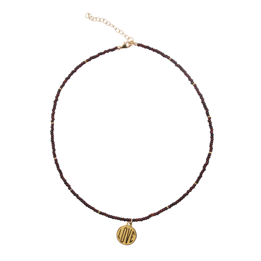 'deep tide love' garnet seed bead necklace with gold love charm
