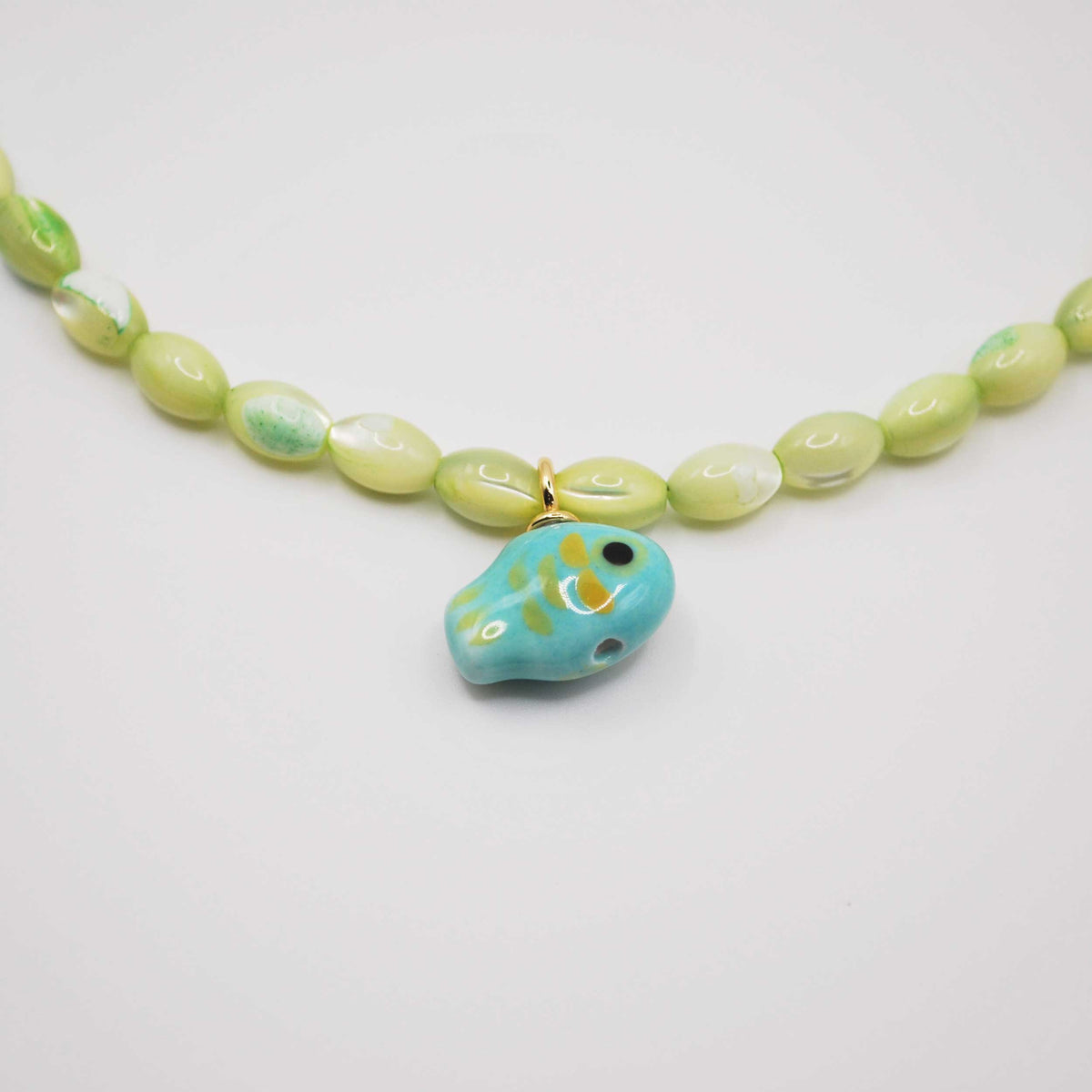 'catch of the day' pearl beaded necklace with hand-painted fish charm