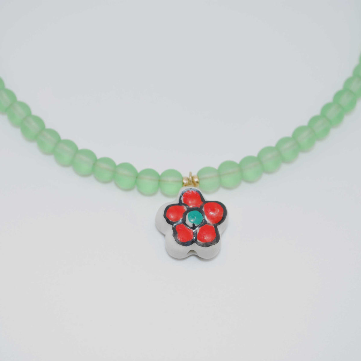 ‘sea glass poppy’ mint beaded necklace with enamel flower charm