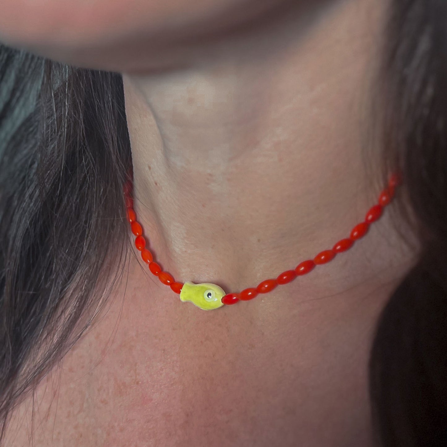 'blue tide minnow' necklace with lime green fish charm
