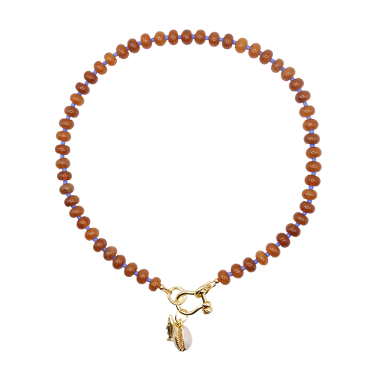 large brown rondelle beads with blue bead accents and a horse shoe carabiner clasp with a cowrie and fish charms