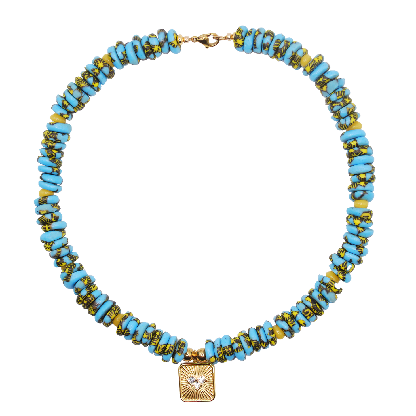 large blue beads with specs of yellow with yellow accent beads and a large sunburst charm featuring inlaid diamonds