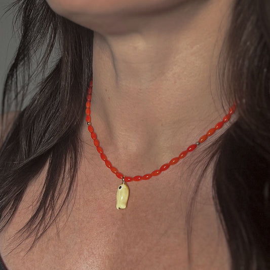 'orange tide' beaded necklace with yellow fish charm