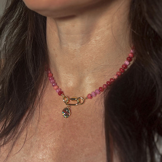 'pink current' vibrant beaded necklace with gold carabiner clasp and lucky/love charm